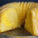 Frosted bundt cake on cake stand